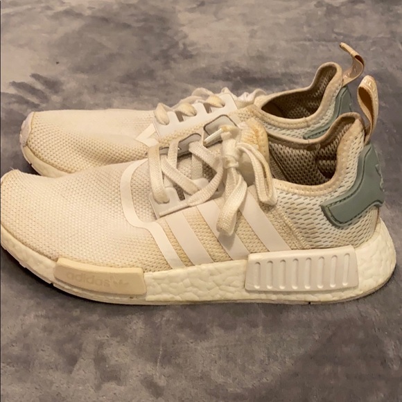 white nmds with blue